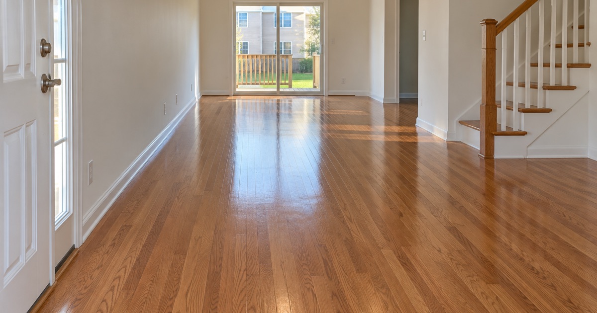 Refinished red oak floor running through the main level of a Severn townhouse to the back sliding door.